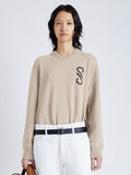 Cropped front image of model wearing Harrison Monogram Sweater in Wool Jacquard in oatmeal