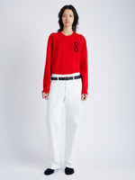 Front image of model wearing Harrison Monogram Sweater in Wool Jacquard in red