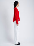 Side image of model wearing Harrison Monogram Sweater in Wool Jacquard in red