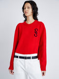 Detail image of model wearing Harrison Monogram Sweater in Wool Jacquard in red