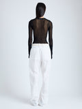 Back image of model wearing Willa Sweater in Sheer Mesh in black