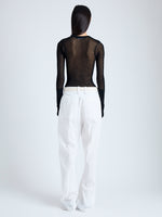 Back image of model wearing Willa Sweater in Sheer Mesh in black