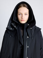 Proenza Schouler Detail image of model wearing Wilder Coat in Stretch Nylon with Fleece in BLACK