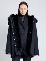 Proenza Schouler cropped front image of model wearing Wilder Coat in Stretch Nylon with Shearling Lining in black