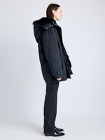 Proenza Schouler side image of model wearing Wilder Coat in Stretch Nylon with Shearling Lining in black