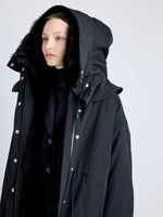 Proenza Schouler detail image of model wearing Wilder Coat in Stretch Nylon with Shearling Lining in black