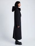 Proenza Schouler Side full length image of model wearing Reed Coat in Brushed Melange Wool with Hood in CHARCOAL MELANGE