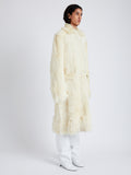 Proenza Schouler Side full length image of model wearing Fiona Coat in Shearling in RESIN