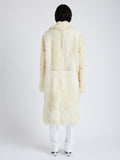 Proenza Schouler Back full length image of model wearing Fiona Coat in Shearling in RESIN