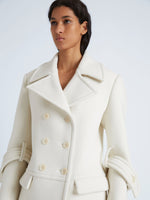 Proenza Schouler Detail image of model wearing Rowen Coat in Eco Double Face Wool in ECRU