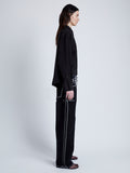 Proenza Schouler Side full length image of model wearing Demi Blouse in Stretch Silk Viscose in BLACK