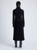 Proenza Schouler Back full length image of model wearing Aida Skirt in Brushed Melange Wool in CHARCOAL MELANGE