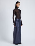 Proenza Schouler Side full length image of model wearing Adriana Skirt in Paper Leather in MIDNIGHT