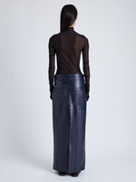 Proenza Schouler Back full length image of model wearing Adriana Skirt in Paper Leather in MIDNIGHT