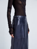 Proenza Schouler Detail image of model wearing Adriana Skirt in Paper Leather in MIDNIGHT