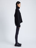 Proenza Schouler Side full length image of model wearing Stilsman Pant in Compact Jersey in BLACK