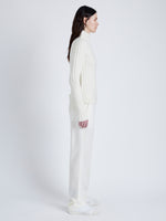 Proenza Schouler Side full length image of model wearing Haven Sweater in Midweight Cashmere Rib in BONE