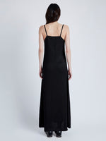 Proenza Schouler Back full length image of model wearing Bella Dress in Lacqured Viscose in BLACK