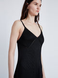 Proenza Schouler Detail image of model wearing Bella Dress in Lacqured Viscose in BLACK