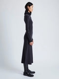 Proenza Schouler Side full length image of model wearing Jocelyn Dress in Midweight Viscose Rib Knit in CHARCOAL