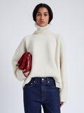 Proenza Schouler cropped front image of model wearing Sandra Turtlneck Sweater in Lofty Eco Cashmere in ECRU