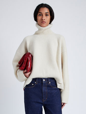 Proenza Schouler cropped front image of model wearing Sandra Turtlneck Sweater in Lofty Eco Cashmere in ECRU