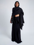 Front image of model wearing Blanket In Textured Boucle Knit in Black