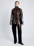 Proenza Schouler Front full length image of model wearing Finch Raincoat In Lacquered Cotton in DARK BROWN/BLACK