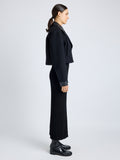 Proenza Schouler Side full length image of model wearing Reyes Jacket in Boiled Wool Jersey in BLACK