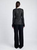 Proenza Schouler Back full length image of model wearing Sophie Long Sleeve Top in Sequin in BLACK