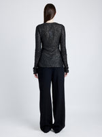 Proenza Schouler Back full length image of model wearing Sophie Long Sleeve Top in Sequin in BLACK