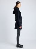 Proenza Schouler Side full length image of model wearing Mei Skirt in Boiled Wool Jersey in BLACK