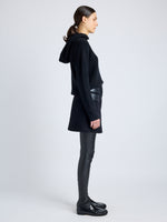 Proenza Schouler Side full length image of model wearing Mei Skirt in Boiled Wool Jersey in BLACK