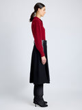 Proenza Schouler Side full length image of model wearing Jeanne Sweater in Eco Cashmere in DARK RED