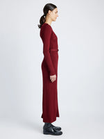 Proenza Schouler Side full length image of model wearing Lauryn Dress in Silk Viscose Knit in DARK RED