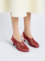 Front cropped image of model wearing Tee Perforated Slingback Pumps in RED