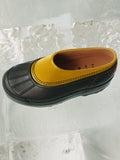 Image of SOREL x Proenza Schouler Caribou Mule in Golden Ochre / Black sitting on block of ice