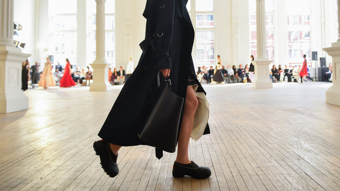 Cropped image of model walking Proenza Schouler SS25 Runway, wearing SOREL x Proenza Schouler Caribou mules in black