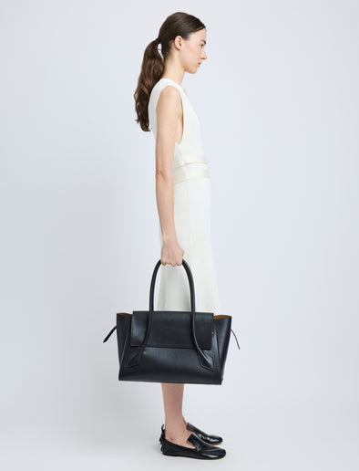 Image of model carrying Tate Bag in Smooth Calfskin in BLACK