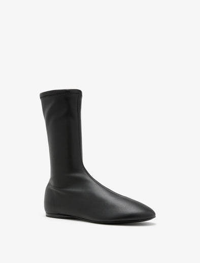 Proenza Schouler Front 3/4 image of Tee Sock Boots in Faux Leather in black