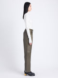 Side image of model wearing Faux Leather Straight Leg Pants in wood