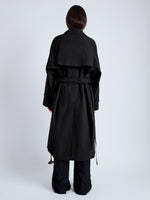 Back image of model wearing Clark Trench Coat in Cotton Nylon in BLACK