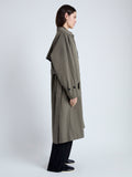 Side image of model wearing Clark Trench Coat in Cotton Nylon in khaki