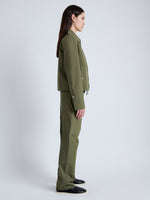 Side full length image of model wearing Barnes Jacket in Rumpled Cotton in DARK OLIVE