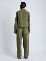 Back full length image of model wearing Barnes Jacket in Rumpled Cotton in DARK OLIVE