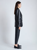 Side image of model wearing Tesema Blazer in Leather in BLACK