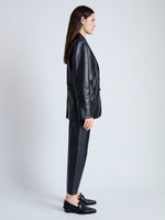 Side image of model wearing Tesema Blazer in Leather in BLACK