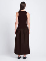 Back full length image of model wearing Malia Dress in Peached Poplin in DARK HICKORY