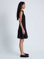 Side image of model wearing Martine Dress in Micro Pleat in BLACK