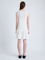 Back full length image of model wearing Martine Dress in Micro Pleat in OFF WHITE